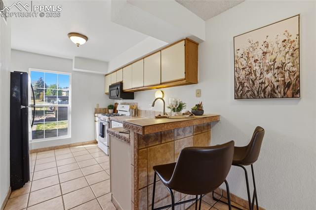MLS Image for 3440  Parkmoor Village  P ,Colorado Springs, Colorado