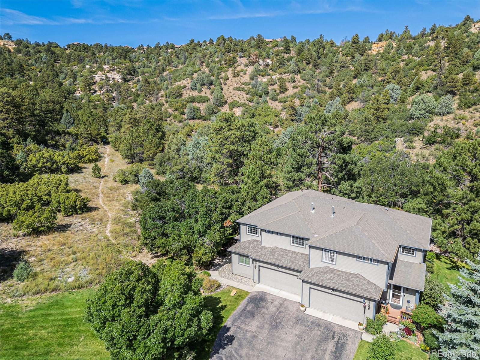 Campus Commons Colorado Springs Home | MLS #: 68278332269  Palm Drive, Colorado Springs Beds: 5 Baths: 4 Price: $575,000