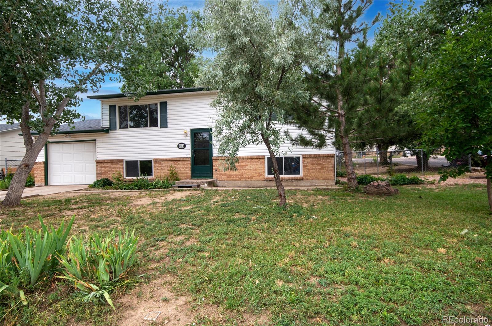 Pikes Peak Colorado Springs Home | MLS #: 19639921884  Pepperwood Drive, Colorado Springs Beds: 4 Baths: 2 Price: $350,000