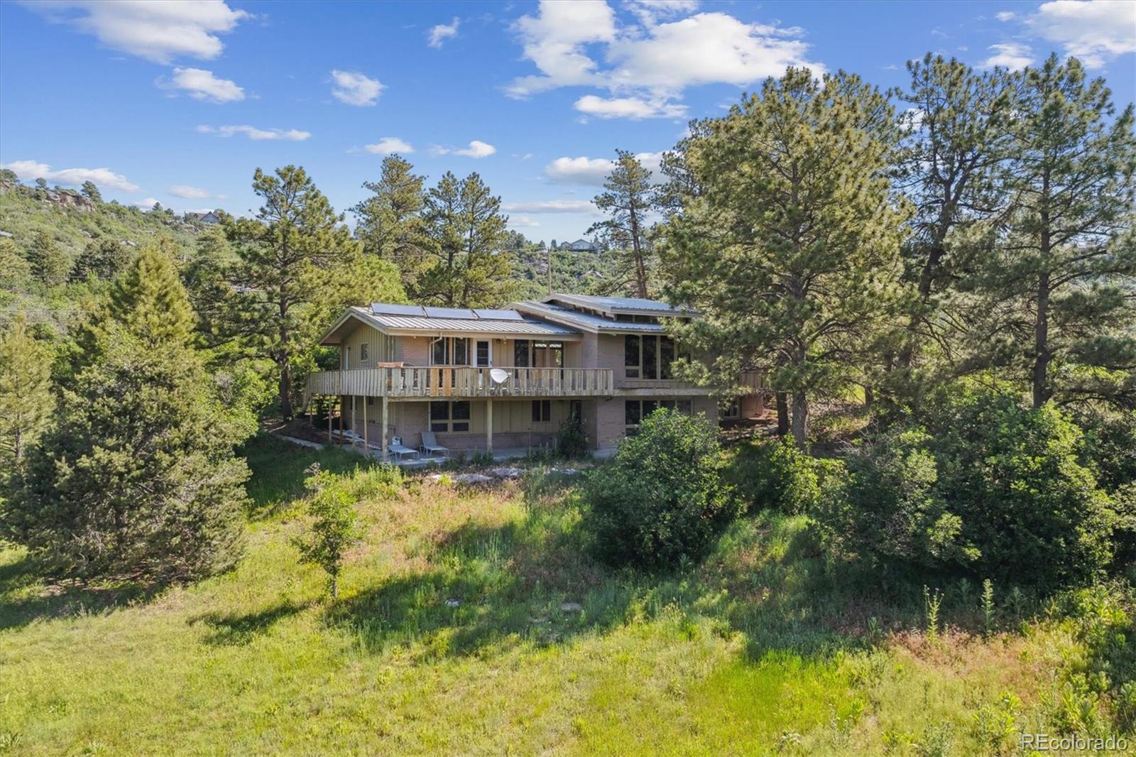Happy Canyon Castle Rock Home | MLS #: 87727575073 N Lariat Drive, Castle Rock Beds: 6 Baths: 4 Price: $900,000