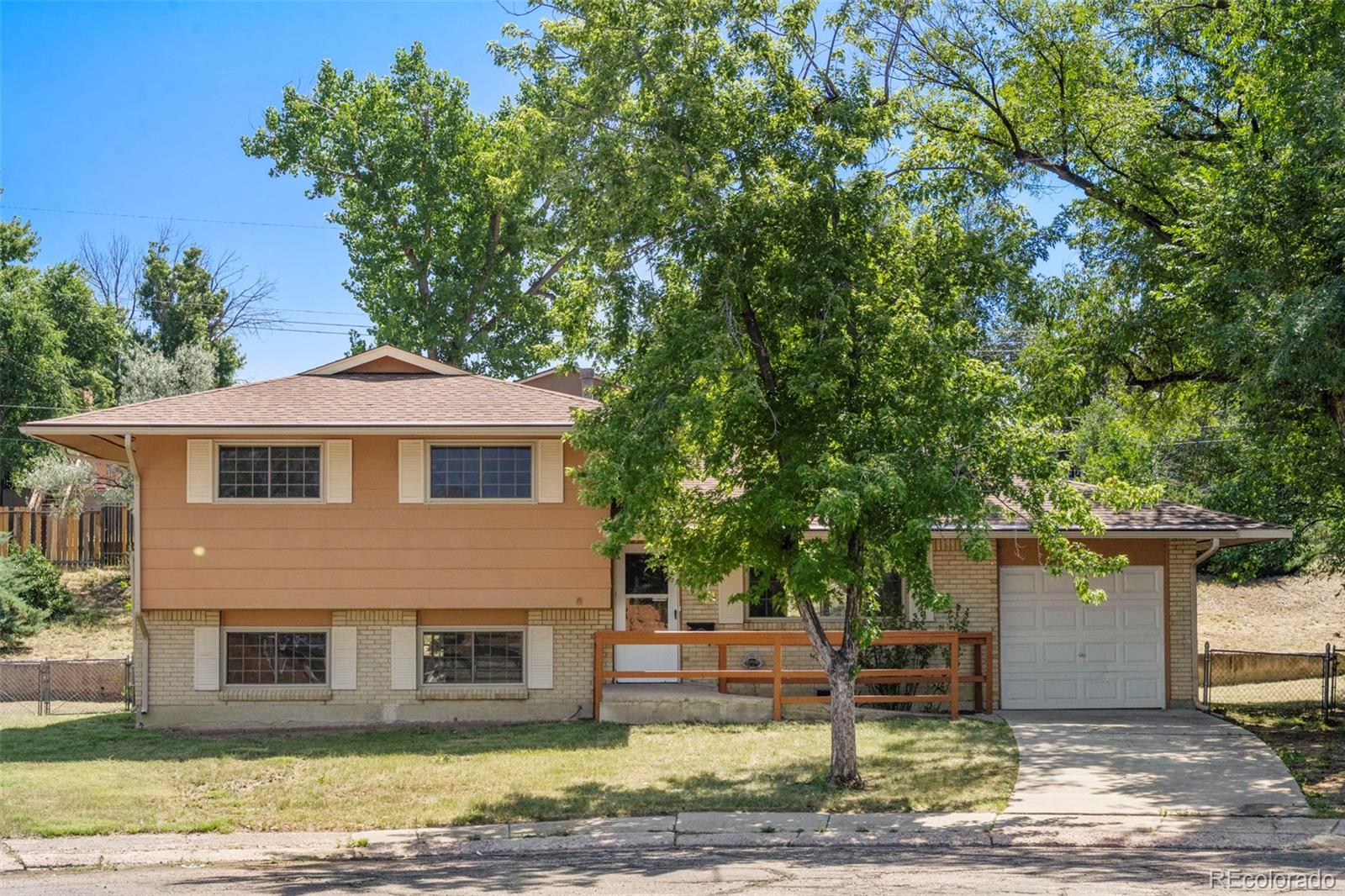Pikes Peak Colorado Springs Home | MLS #: 78372991827  Montezuma Drive, Colorado Springs Beds: 4 Baths: 3 Price: $365,000