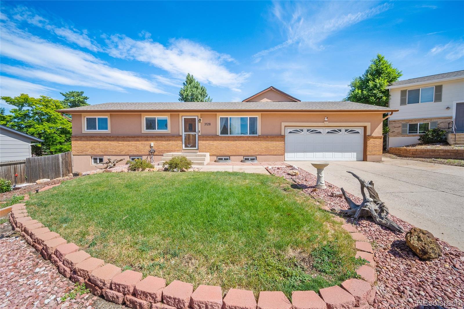 Vista Grande Colorado Springs Home | MLS #: 91844963128  Sapporo Court, Colorado Springs Beds: 4 Baths: 3 Price: $499,000
