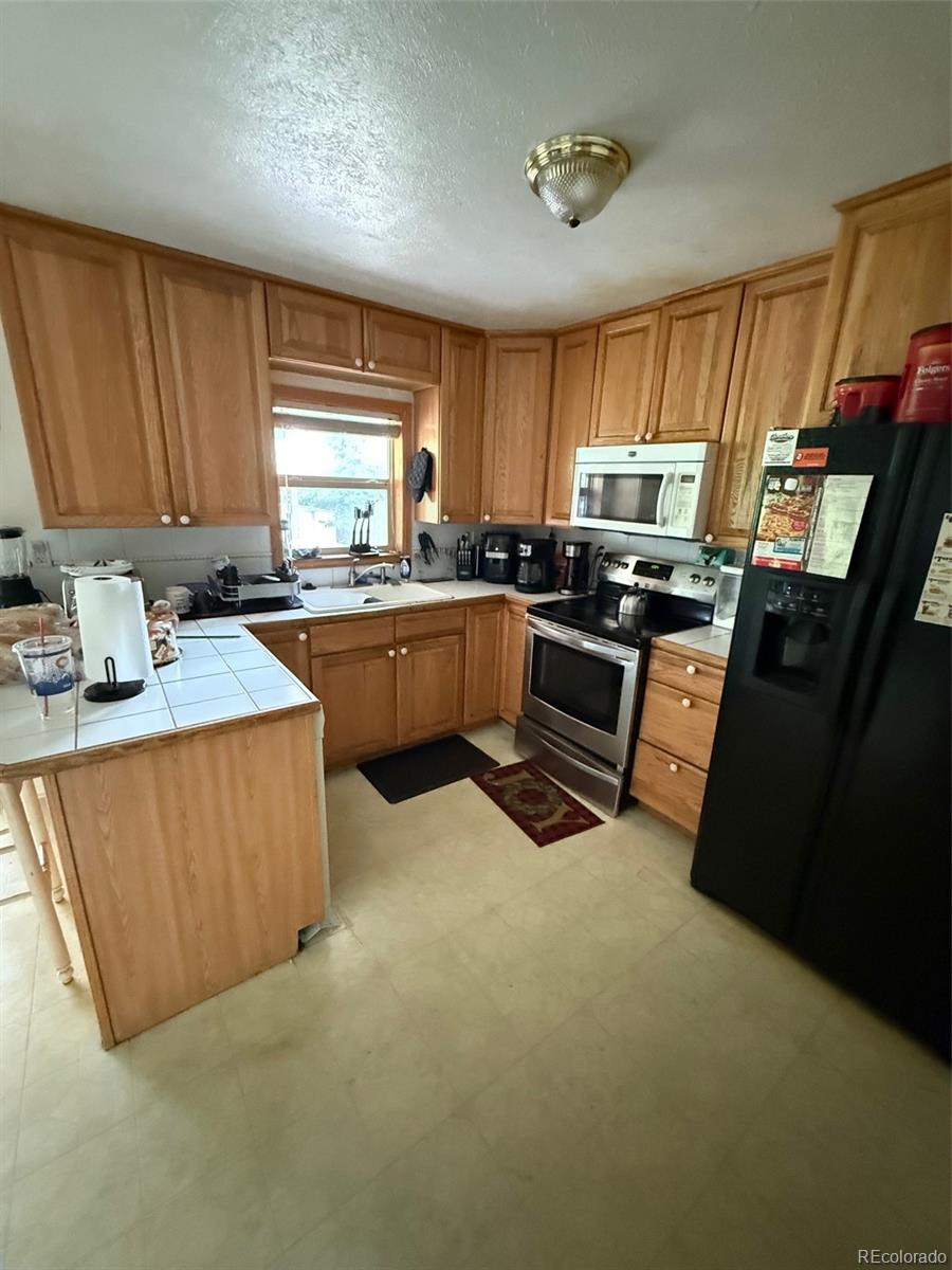 Meadowood Aurora Home | MLS #: 85802353222 S Norfolk Way, Aurora Beds: 5 Baths: 3 Price: $440,000