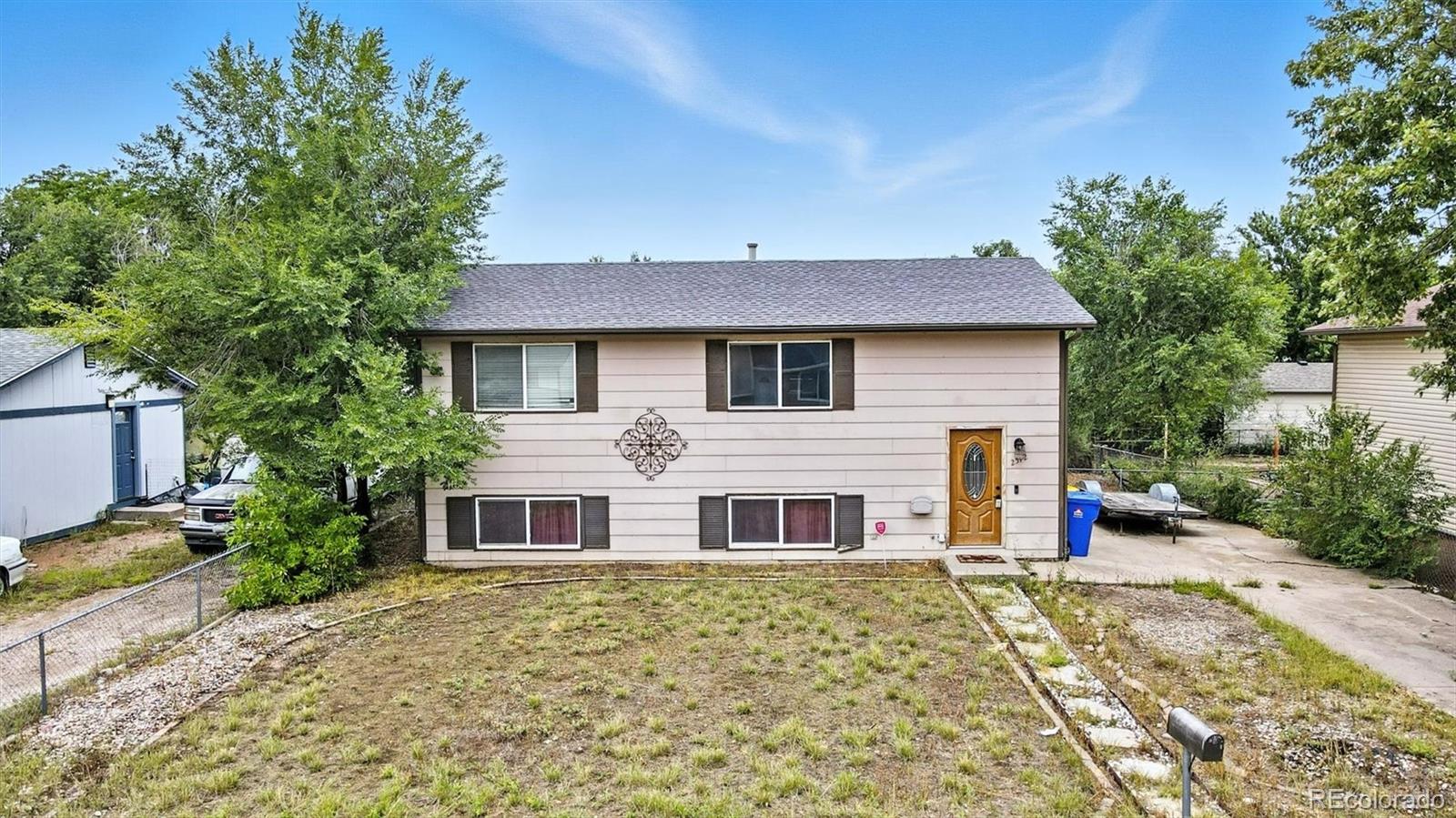 Pikes Peak Colorado Springs Home | MLS #: 55896842512  Barkman Drive, Colorado Springs Beds: 4 Baths: 2 Price: $300,000