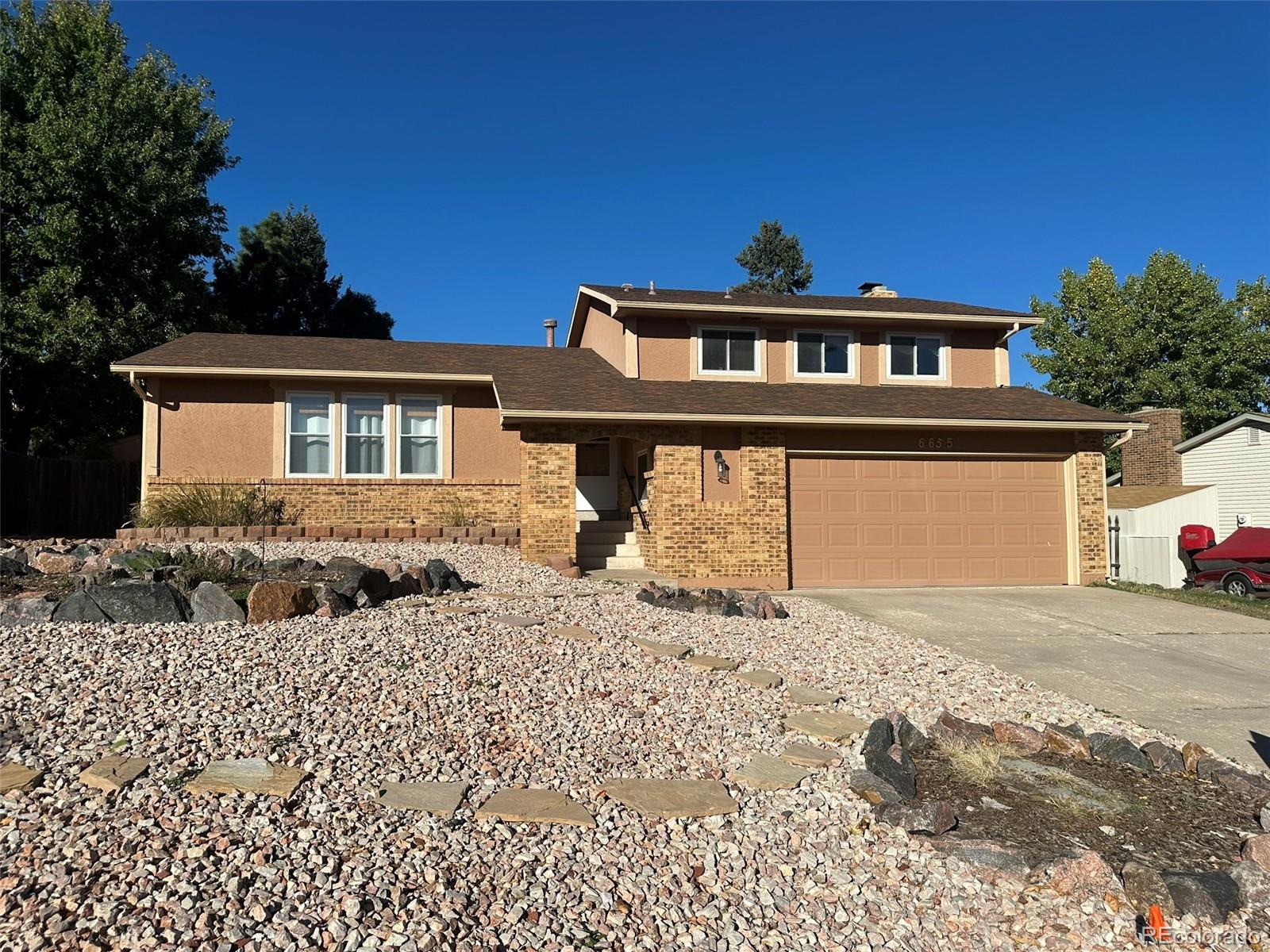 Vista Grande Colorado Springs Home | MLS #: 93117476655  Lange Circle, Colorado Springs Beds: 5 Baths: 3 Price: $399,999