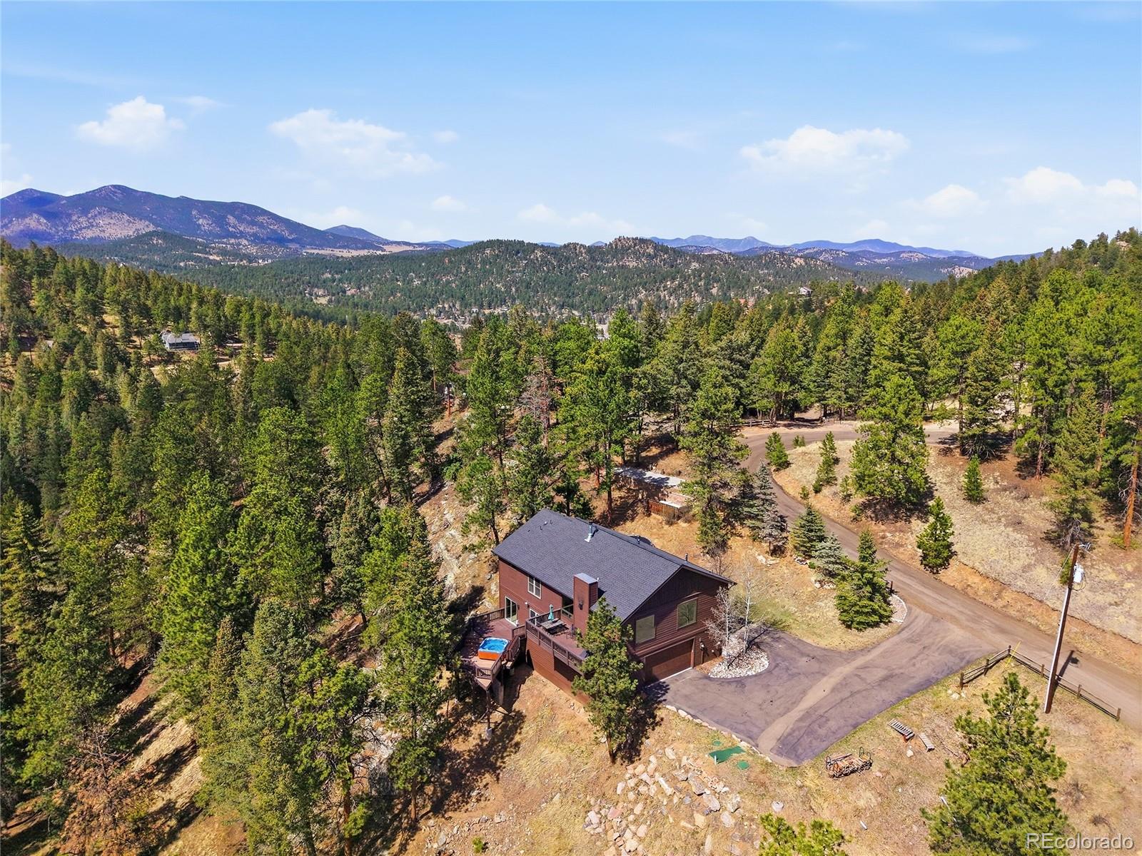  Evergreen Home | MLS #: 849320626905  Mountain Park Road, Evergreen Beds: 4 Baths: 3 Price: $975,000