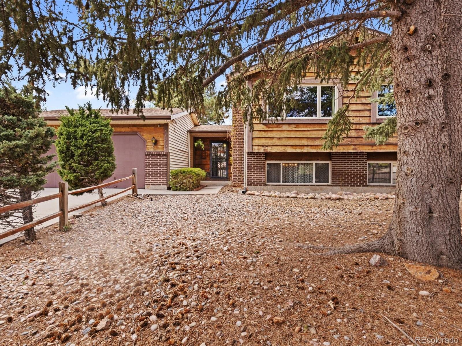 Rustic Hills Colorado Springs Home | MLS #: 38235361110  Branding Iron Drive, Colorado Springs Beds: 4 Baths: 2 Price: $415,000