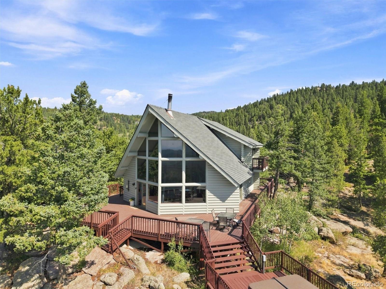 Kings Valley Conifer Home | MLS #: 460298730851  Pike View Drive, Conifer Beds: 4 Baths: 3 Price: $995,000