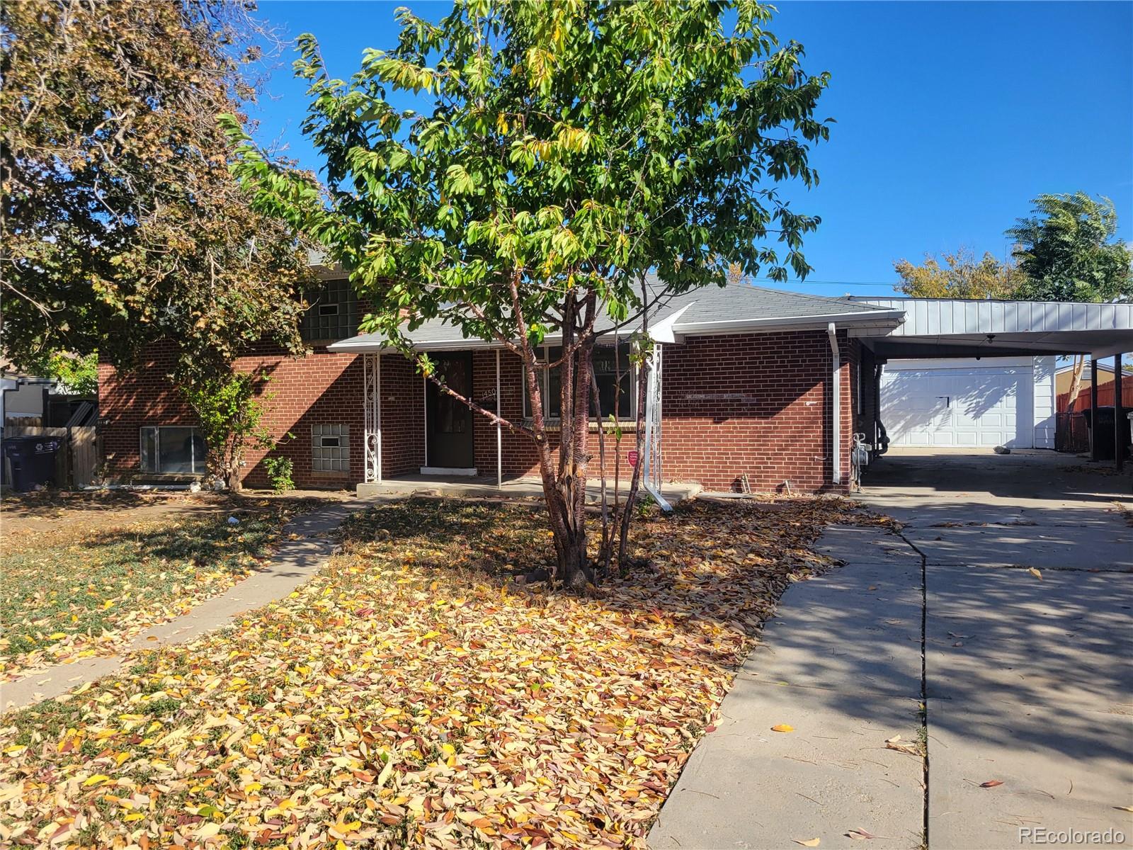 1450 S Eliot Street, denver MLS: 5136757 Beds: 4 Baths: 2 Price: $410,000