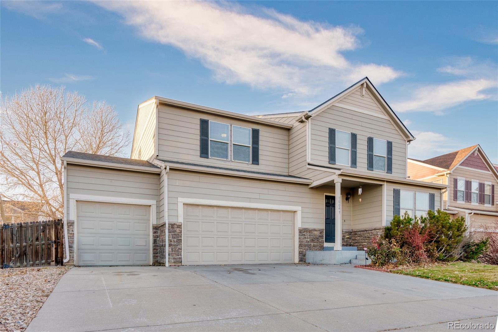 10049  Granby Drive, commerce city MLS: 8178416 Beds: 4 Baths: 3 Price: $545,000