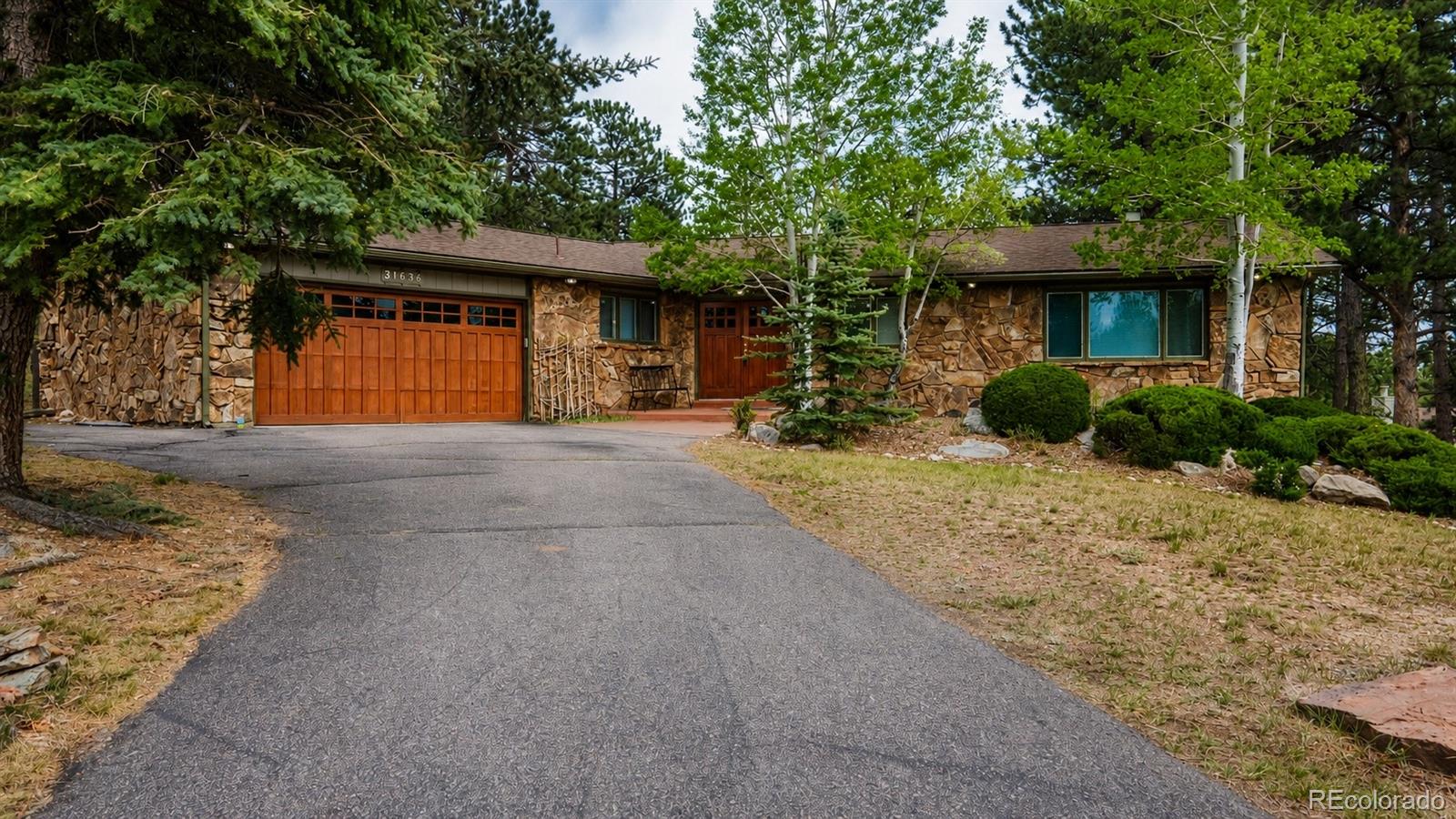 Hiwan Evergreen Home | MLS #: 676478031636  Canyon Circle, Evergreen Beds: 4 Baths: 3 Price: $1,168,000