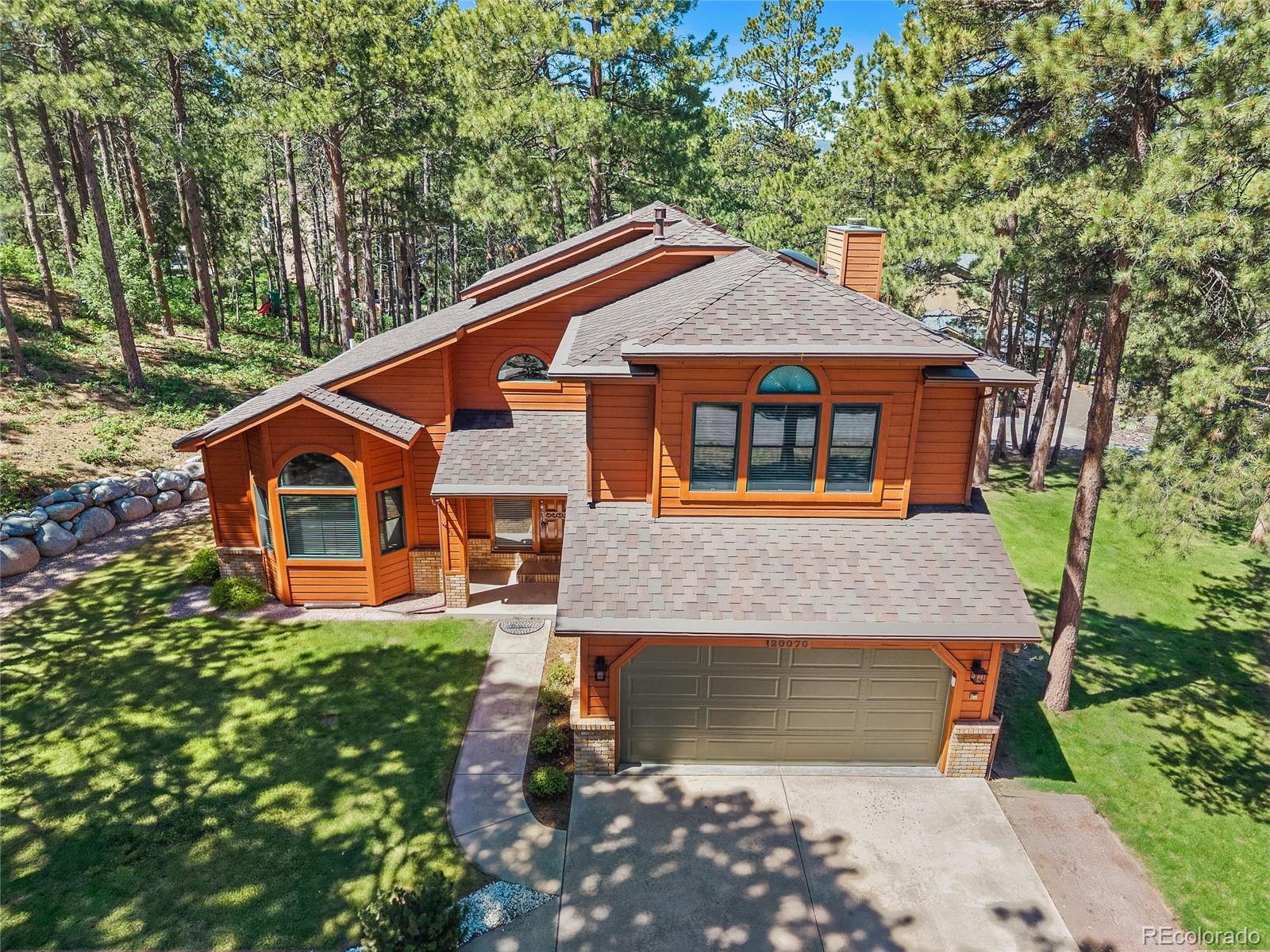 Woodcrest Monument Home | MLS #: 582051320070  Lofty Pine Lane, Monument Beds: 4 Baths: 4 Price: $814,000