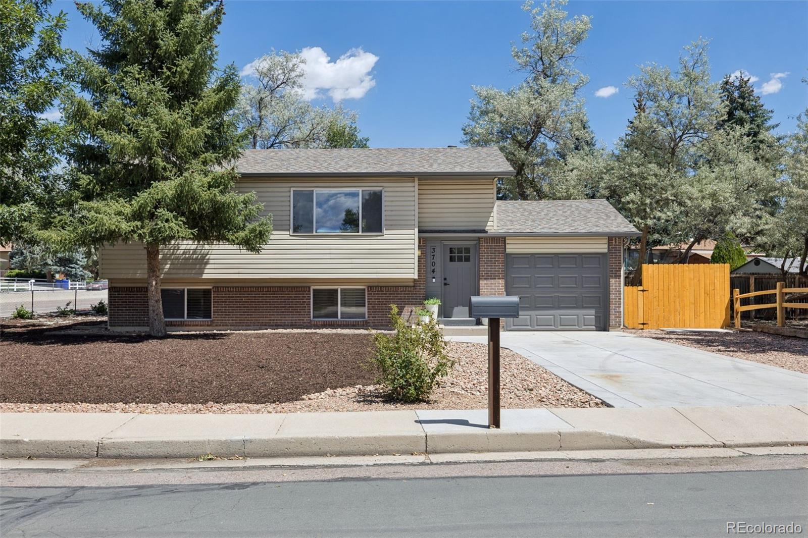 Vista Grande Colorado Springs Home | MLS #: 22530263704  Surrey Lane, Colorado Springs Beds: 4 Baths: 2 Price: $409,500