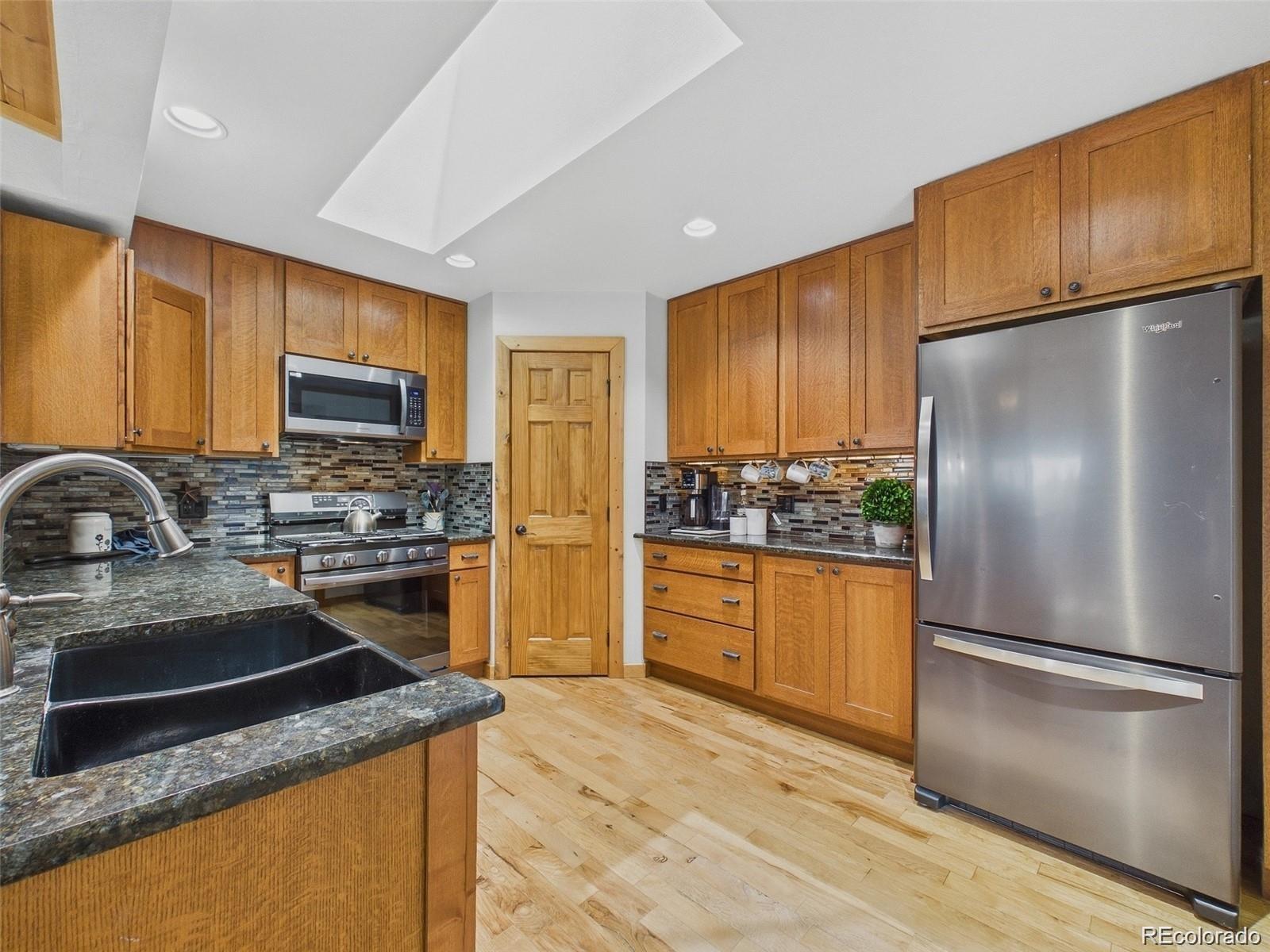 Buffalo Park Estates Evergreen Home | MLS #: 91761836773  Snowshoe Trail, Evergreen Beds: 4 Baths: 3 Price: $875,000
