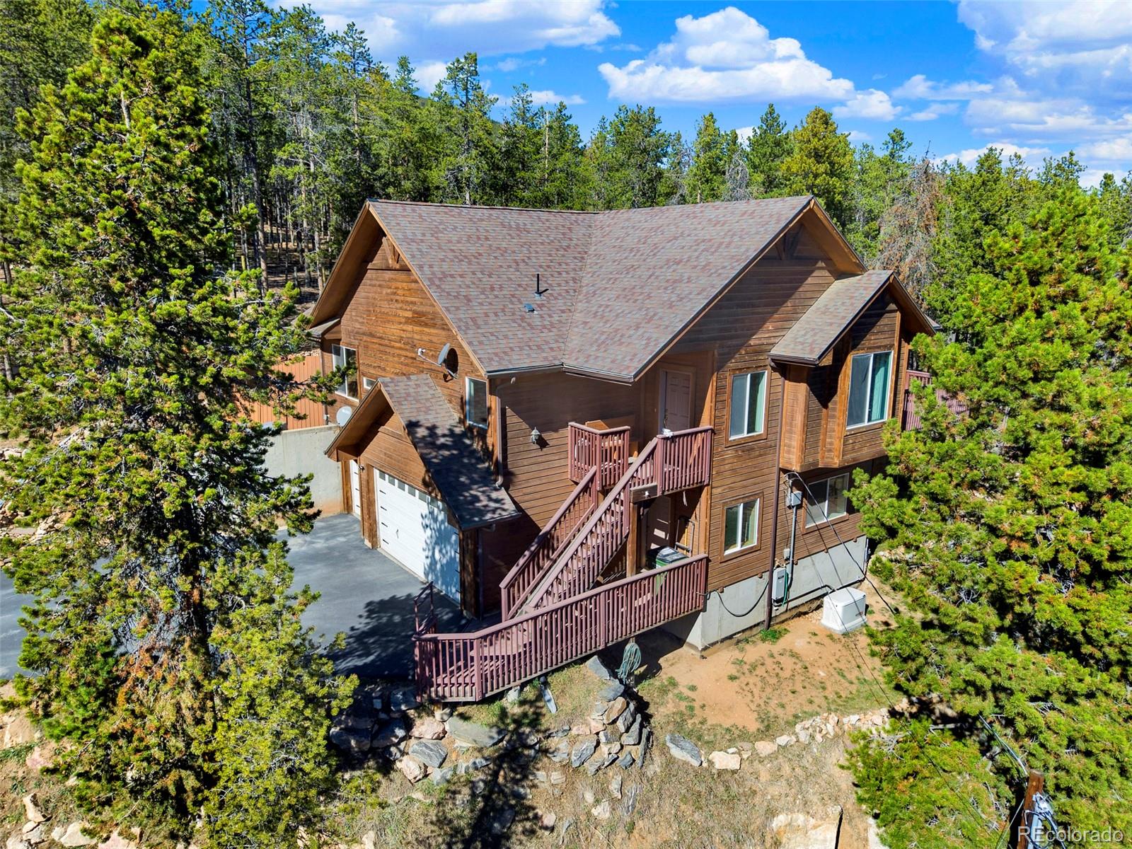 Brook Forest Evergreen Home | MLS #: 2992621191  Aspen Way, Evergreen Beds: 3 Baths: 3 Price: $780,000