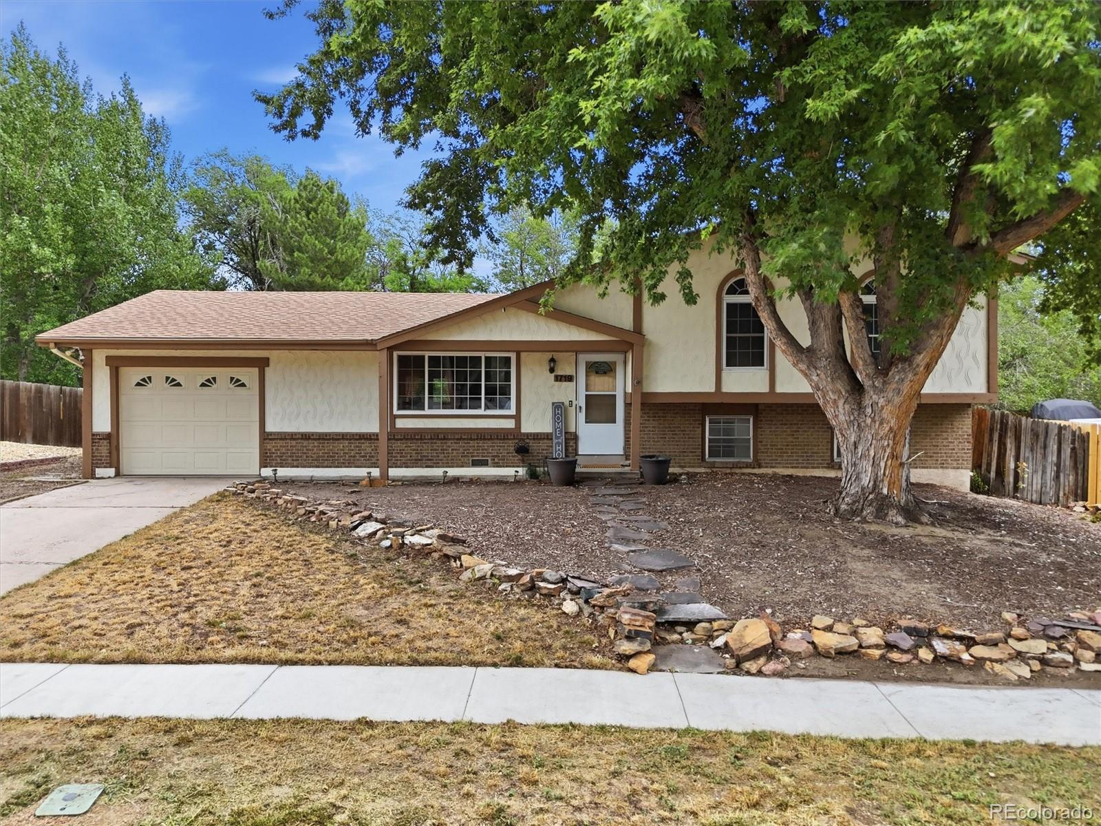  Colorado Springs Home | MLS #: 16906591719  Wooten Road, Colorado Springs Beds: 4 Baths: 3 Price: $400,000